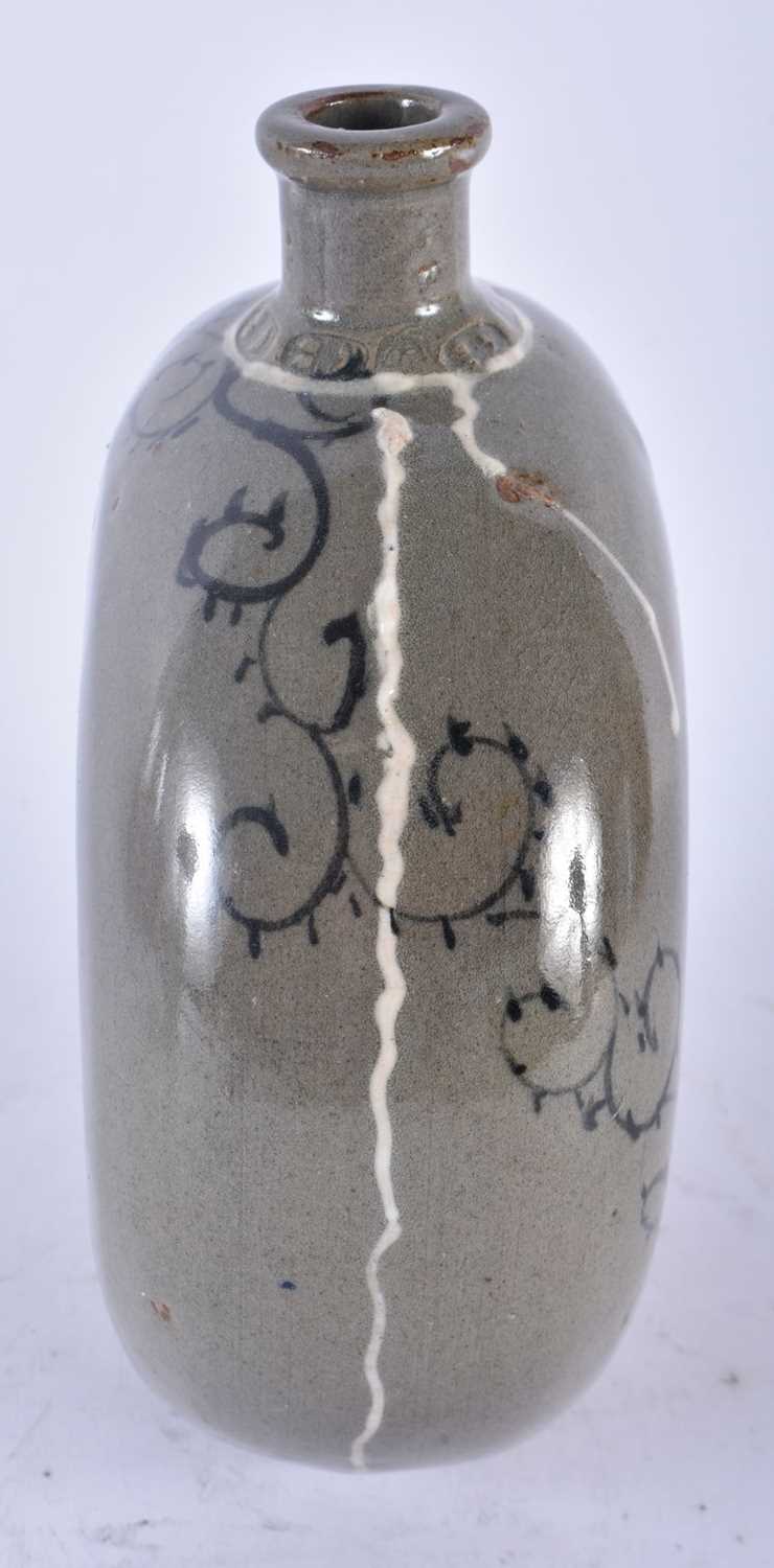 A KOREAN JOSEON DYNASTY CELADON DOUGHNUT FORM STONEWARE FLASK. 18cm x 14 cm. - Image 2 of 4