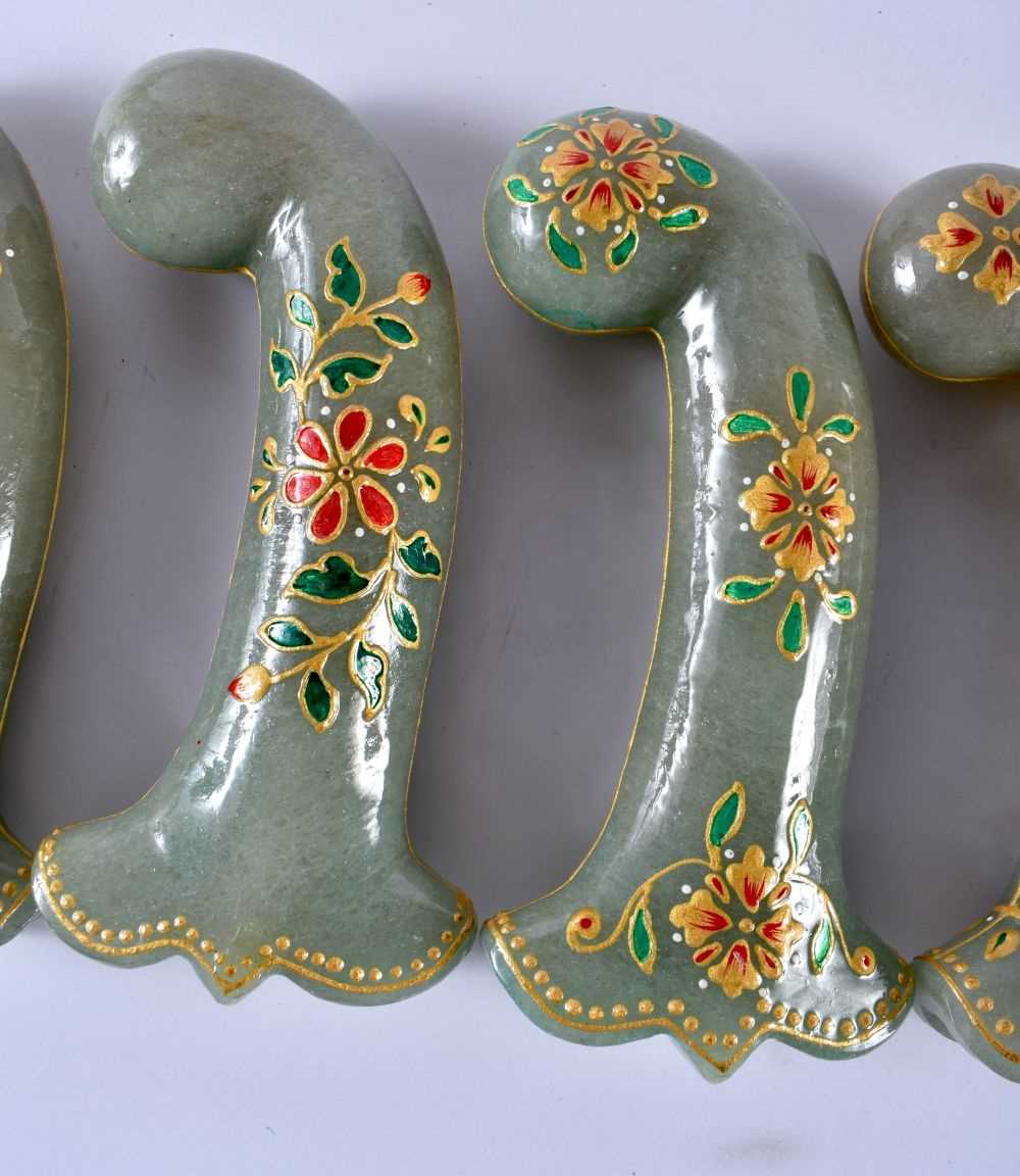 A SET OF FIVE MIDDLE EASTERN QAJAR LACQUER HARDSTONE DAGGER HANDLES overlaid with foliage and vines. - Image 3 of 6