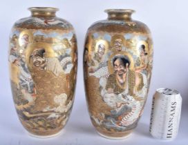 A LARGE PAIR OF 19TH CENTURY JAPANESE MEIJI PERIOD SATSUMA VASES painted with immortals. 30cm x 14