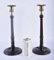 A PAIR OF EDWARDIAN MAHOGANY CANDLESTICKS. 34 cm high.