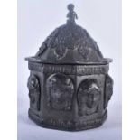 AN EARLY 19TH CENTURY LEAD TOBACCO BOX AND COVER decorated in relief with classical mask heads. 17