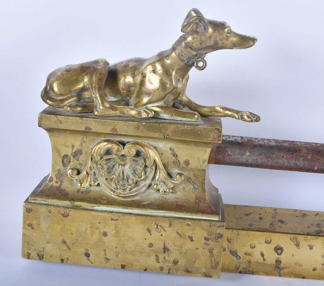 A LOVELY REGENCY COUNTRY HOUSE ORMOLU AND STEEL GREYHOUND FENDER formed with two recumbent hounds. - Image 2 of 4