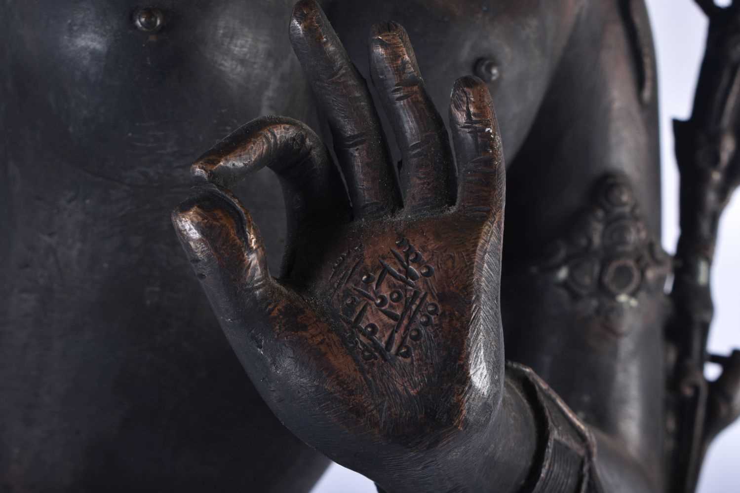 A LARGE 19TH CENTURY INDIAN TIBETAN BRONZE FIGURE OF A STANDING DEITY modelled upon a leaf form - Image 3 of 8