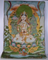 A Tibetan silk Tanka 90 x 62 cm
