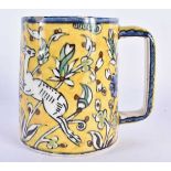 A MIDDLE EASTERN FAIENCE IZNIK JERUSALEM POTTERY MUG painted with leaping deer. 12 cm x 10 cm.