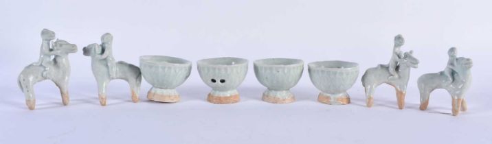 A SET OF FOUR CHINESE QING DYNASTY QINGBAI STONEWARE ANIMALS together with four similar censers.