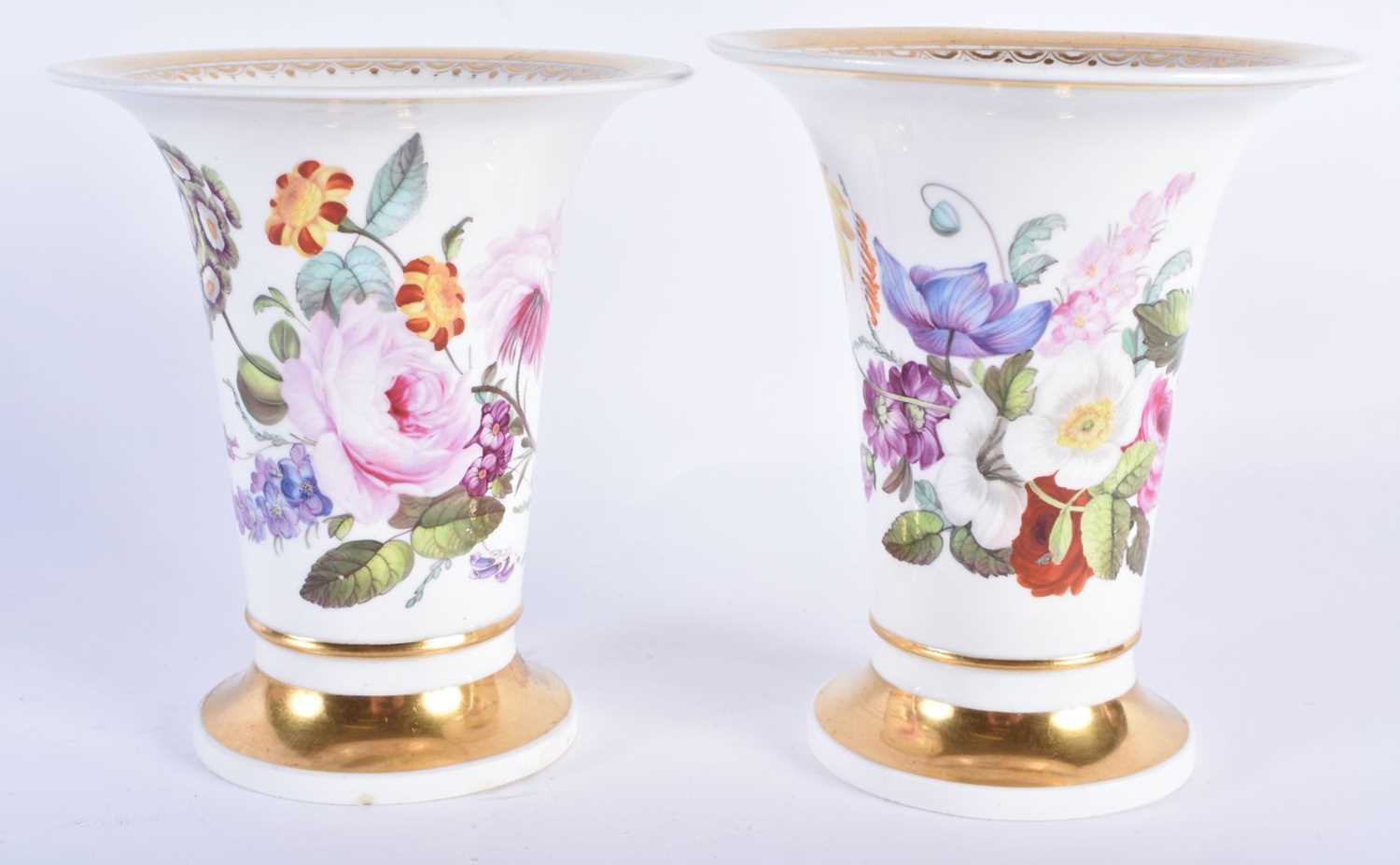A PAIR OF EARLY 19TH CENTURY DERBY PORCELAIN VASES painted with flowers. 13 cm x 9 cm.