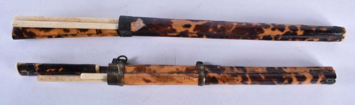 A PAIR OF 19TH CENTURY CHINESE CARVED TORTOISESHELL CHOPSTICK HOLDERS. 27 cm long.