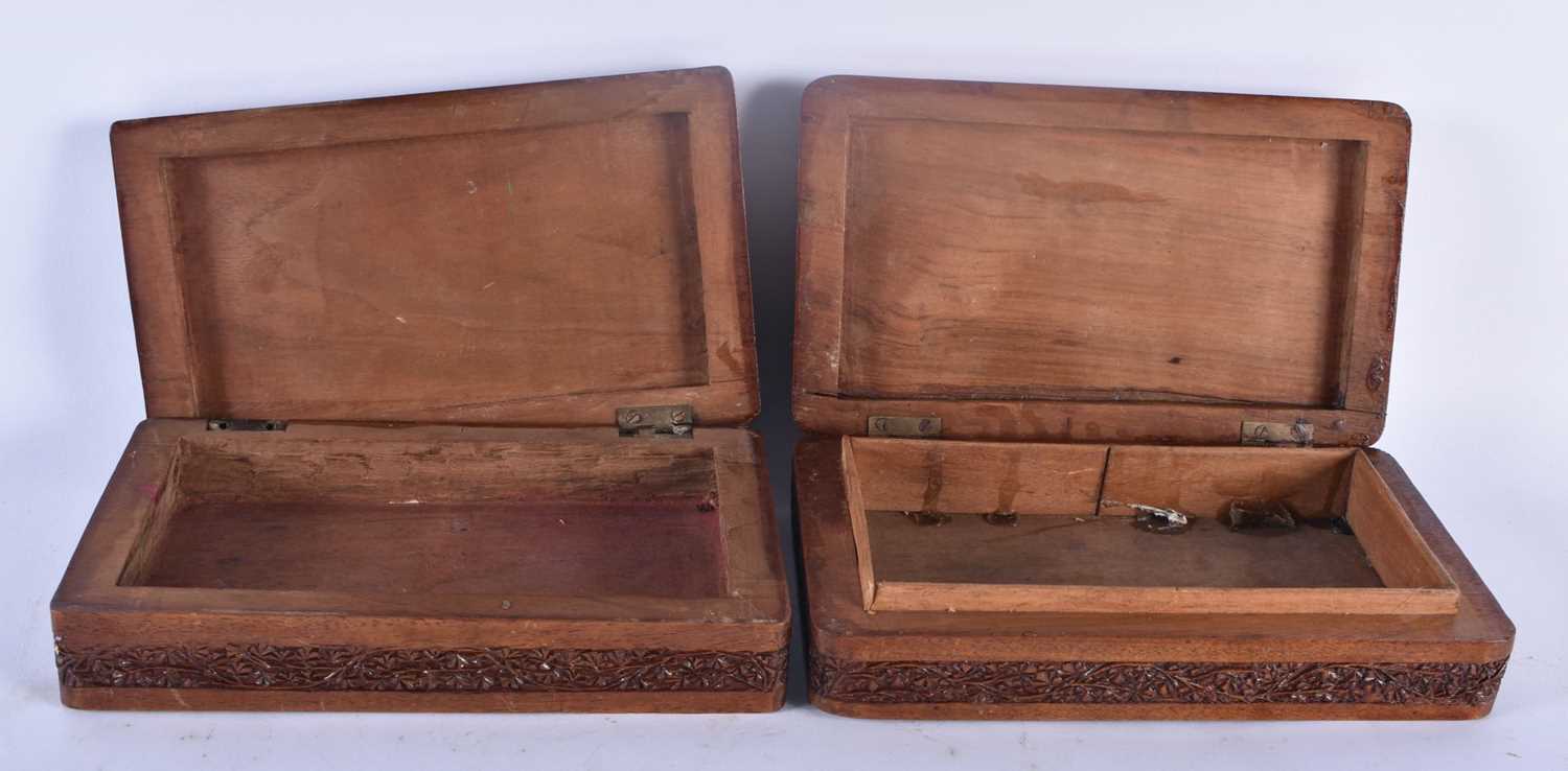 A PAIR OF 19TH CENTURY ANGLO INDIAN BURMESE ASIAN CARVED WOOD CASKETS decorated in relief with - Image 4 of 5