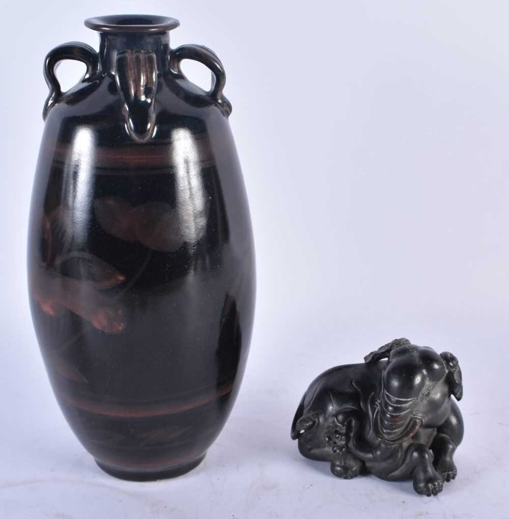 A CHINESE POTTERY VASE 20th Century, together with a bronze scroll weight. Largest 26cm high. (2)