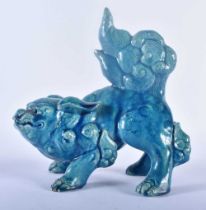 A 19TH CENTURY CHINESE STYLE BLUE GLAZED FIGURE OF A BUDDHISTIC LION possibly Burmantofts. 21 cm x