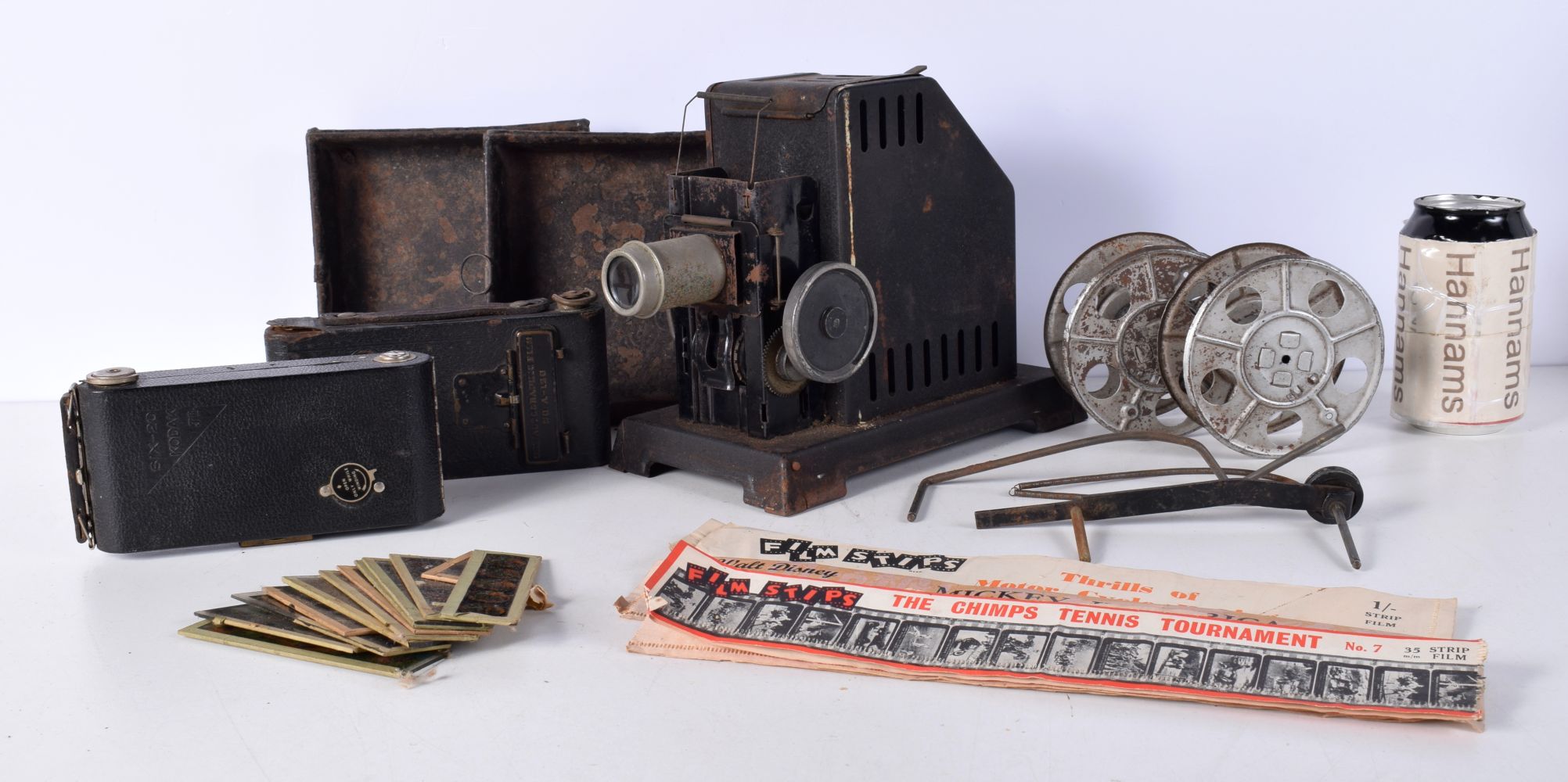 A vintage Bing Cine film projector together with two Kodak cameras (Qty)