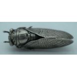 AN EARLY 20TH CENTURY JAPANESE MEIJI PERIOD SILVER LOCUST BROOCH. 6.5 grams. 4.75 cm x 1.5 cm.