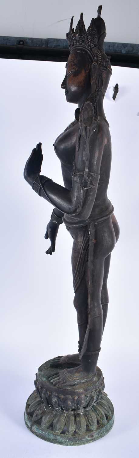 A LARGE 19TH CENTURY INDIAN TIBETAN BRONZE FIGURE OF A STANDING DEITY modelled upon a leaf form - Image 6 of 8