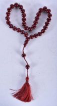 A TURKISH CHERRY AMBER TYPE TESBIH NECKLACE. 93 grams. 94 cm long.