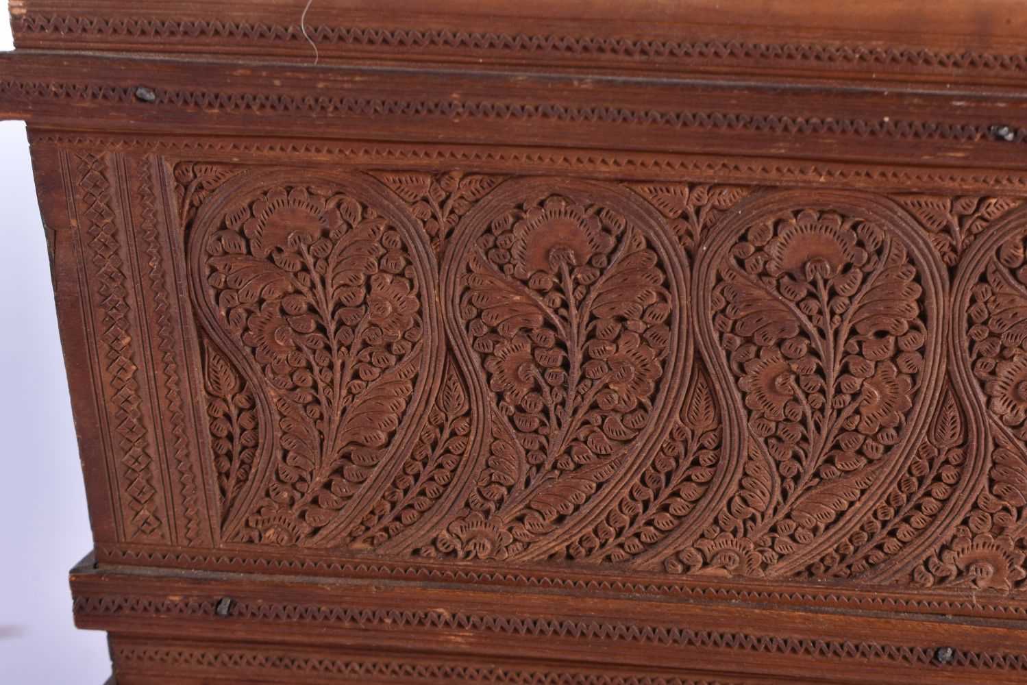 A FINE MID 19TH CENTURY ANGLO INDIAN CARVED WOOD CASKET AND COVER decorated with mythical birds, - Image 2 of 12