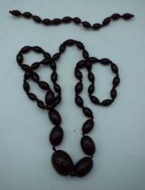 A CHERRY AMBER TYPE NECKLACE. 54 grams. 76 cm long.