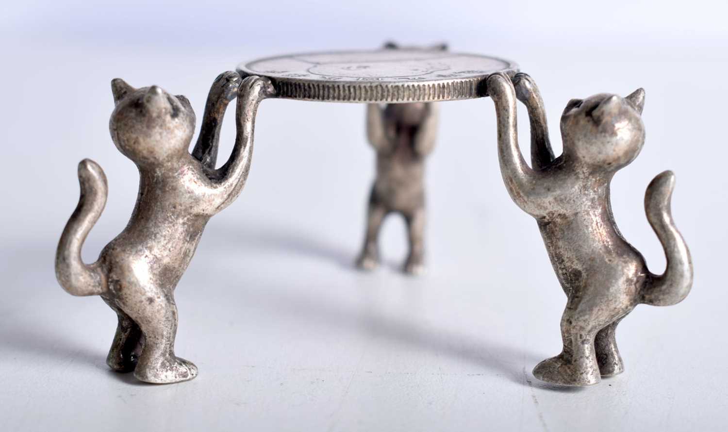 A CHINESE WHITE METAL CAT COIN STAND. 102 grams. 6.5 cm x 3.75 cm. - Image 3 of 3