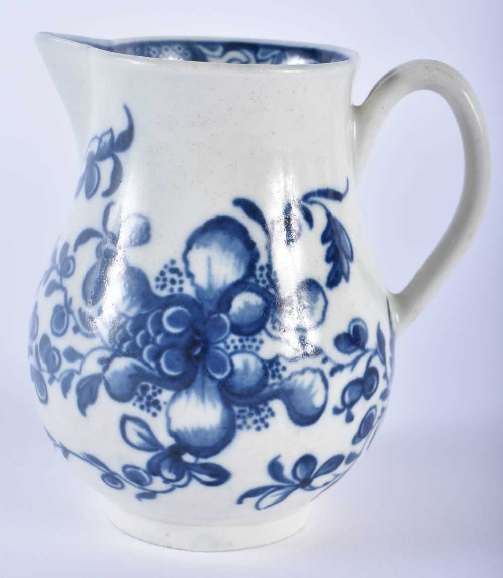 AN 18TH CENTURY WORCESTER BLUE AND WHITE PORCELAIN SPARROW BEAK JUG painted with floral sprays. 9 cm