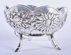 A 19TH CENTURY JAPANESE MEIJI PERIOD HAMMERED REPOUSSE SILVER BOWL decorated with flowers. 180