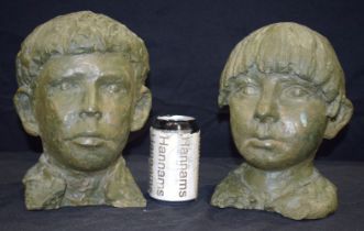 Two Childs bust cast in metal 24 cm (2)