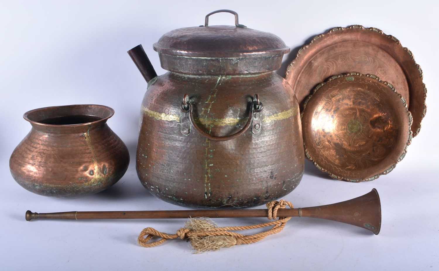 A LARGE EARLY 20TH CENTURY MALAYSIAN HAMMERED COPPER COOKING POT together with other dishes & a