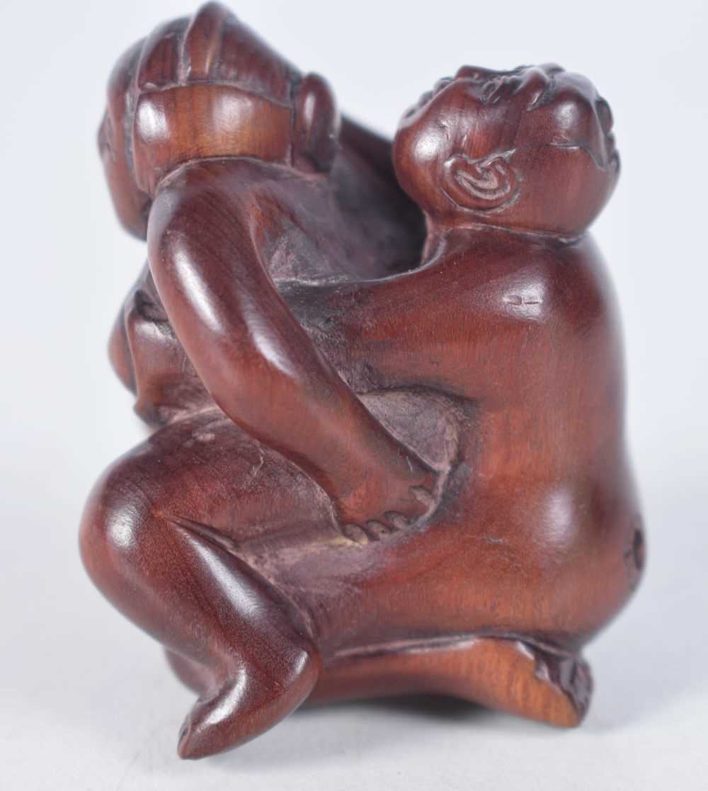 A Carved Hardwood Erotic Netsuke. 4.7cm x 4.1cm x 3.7cm, weight 27g - Image 2 of 4