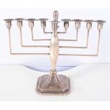 A Silver Menorah by Britton, Gould & Co. Hallmarked Birmingham 1936. 20 cm x 21cm x 9cm, weight