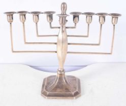 A Silver Menorah by Britton, Gould & Co. Hallmarked Birmingham 1936. 20 cm x 21cm x 9cm, weight