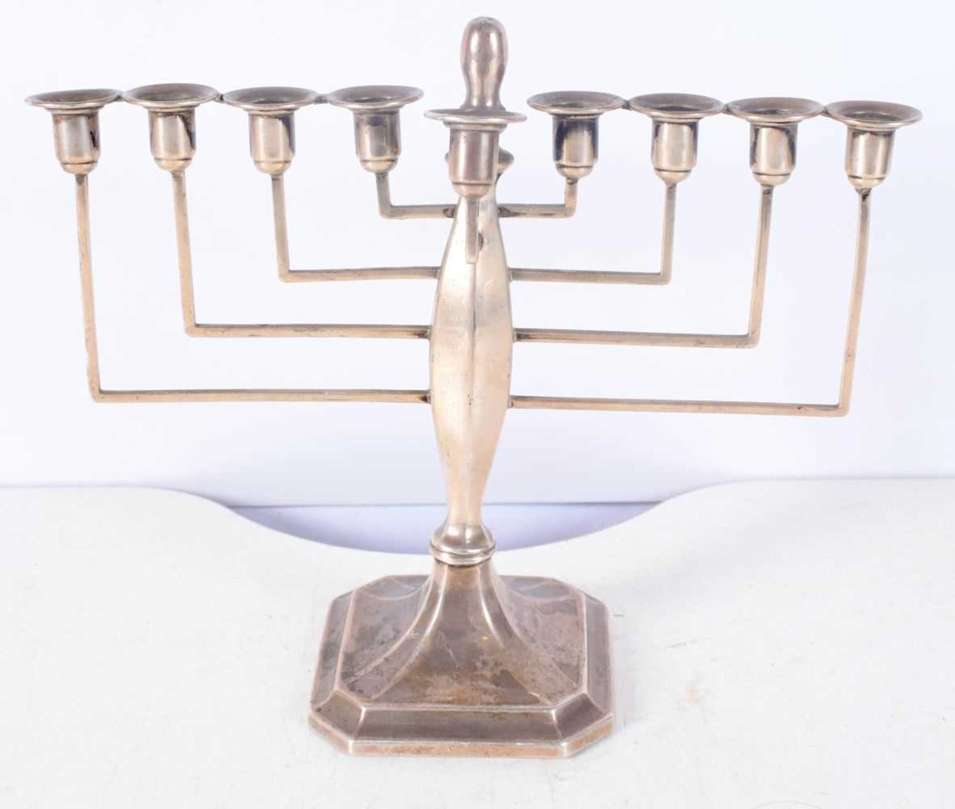 A Silver Menorah by Britton, Gould & Co. Hallmarked Birmingham 1936. 20 cm x 21cm x 9cm, weight