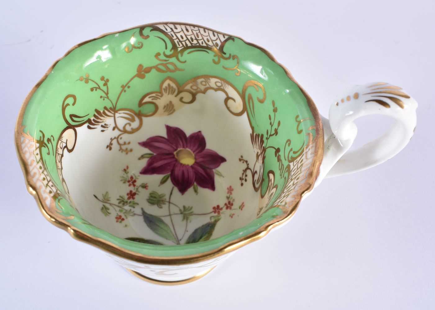 English fine cup and saucer, with coffee cup painted with large specimen flowers under a lime - Image 7 of 8