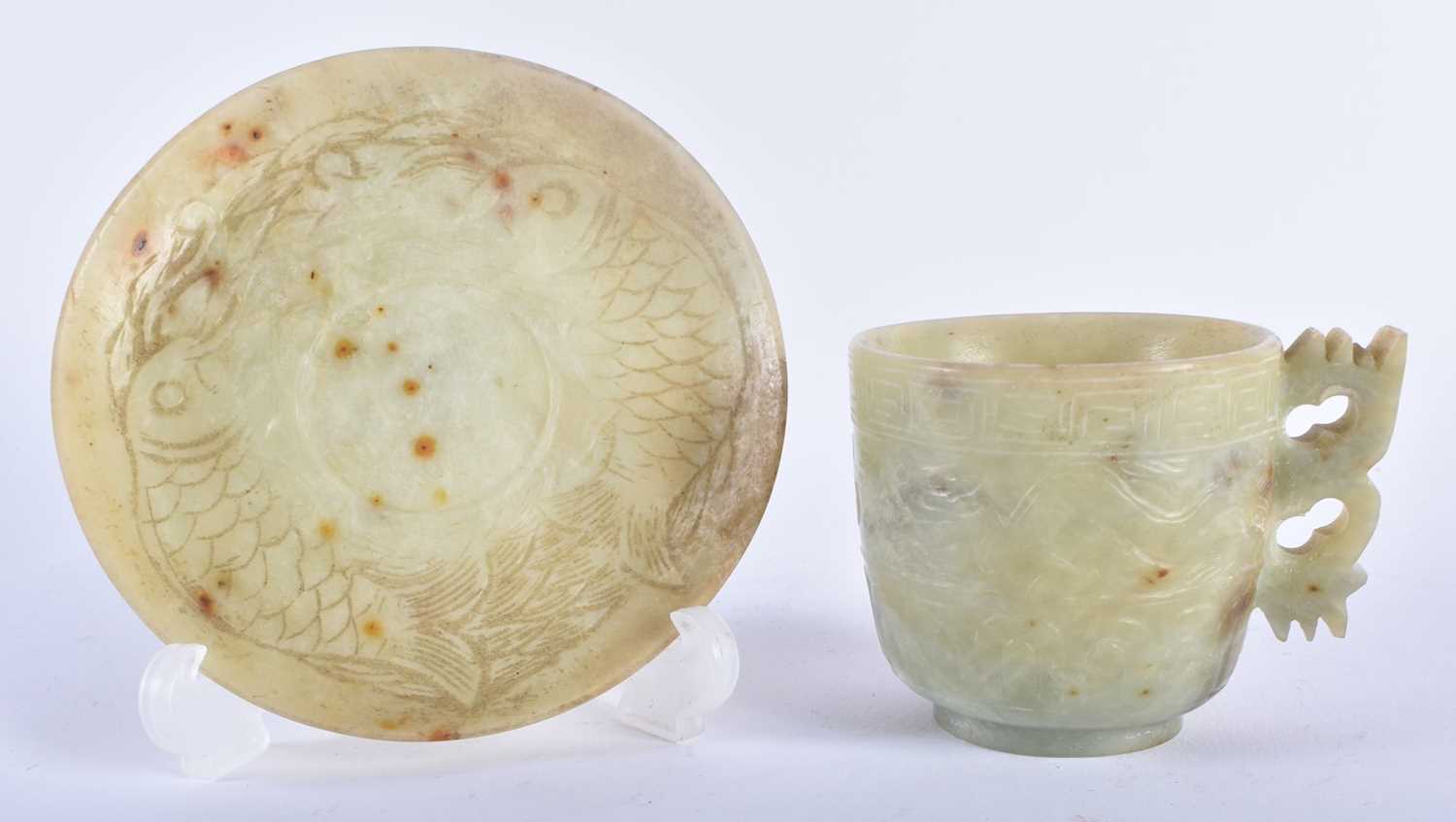 A LATE 19TH CENTURY CHINESE CARVED GREEN STONE CUP AND SAUCER possibly Jade. 12 cm diameter. (2)