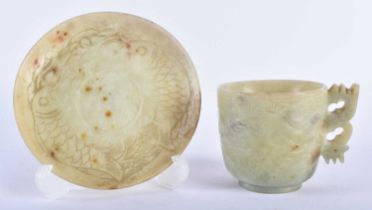A LATE 19TH CENTURY CHINESE CARVED GREEN STONE CUP AND SAUCER possibly Jade. 12 cm diameter. (2)