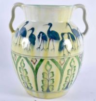 AN UNUSUAL EUROPEAN EARLY 20TH CENTURY TWIN HANDLED PORCELAIN VASE signed A.H, painted with birds