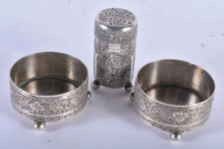A PAIR OF 19TH CENTURY ISLAMIC SILVER SALTS and another. 117 grams. Largest 5.5 cm x 3 cm. (3)