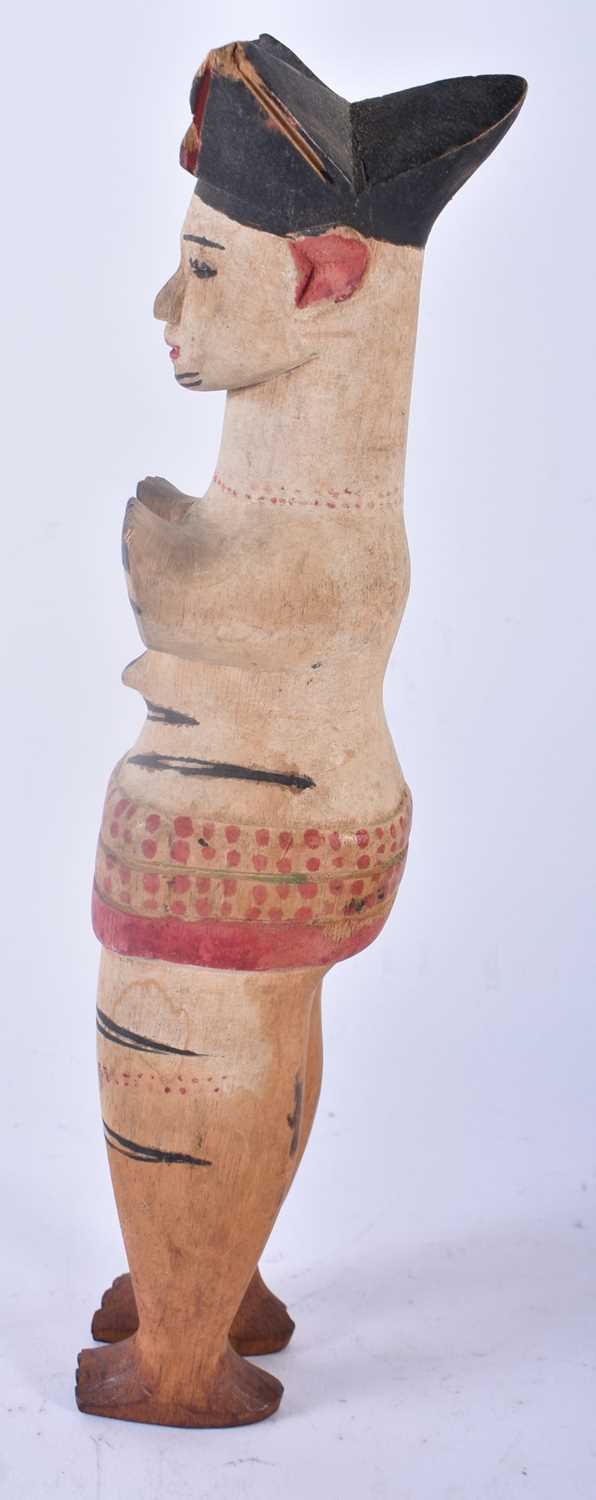 AN UNUSUAL AFRICAN TRIBAL PAINTED WOOD FIGURE modelled with hands covering her breasts. 30cm high. - Image 2 of 4