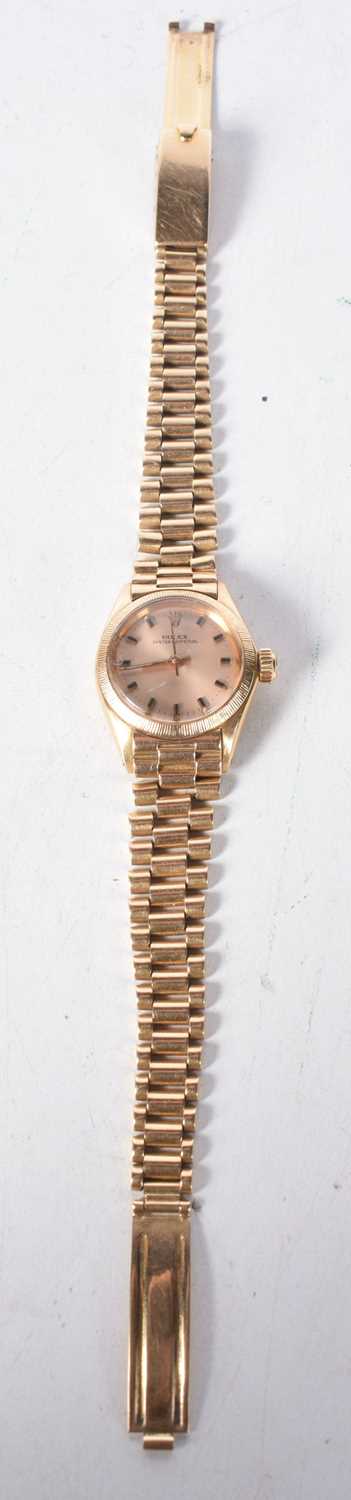 An 18 Carat Gold Ladies Rolex Oyster Perpetual Watch. Stamped 750, 2.7cm dial incl crown, Running,