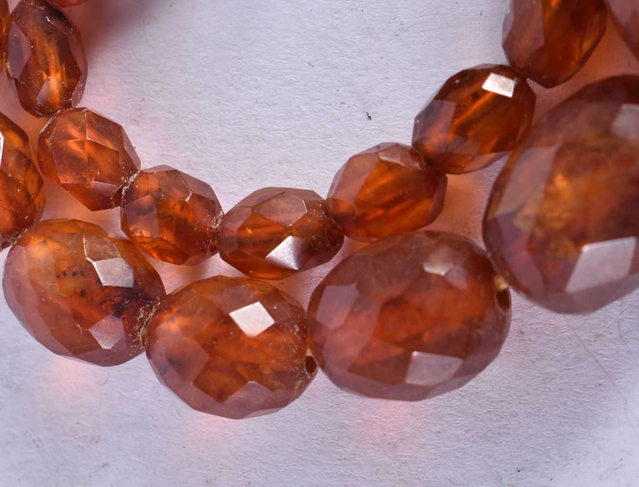 A Faceted Amber Bead Necklace. 58cm long, largest Bead 20mm, weight 35g - Image 2 of 3