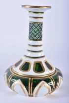 A 19TH CENTURY BOHEMIAN GREEN AND WHITE ENAMELLED GLASS VASE with jewelled lozenge decoration to the