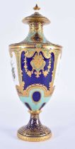 Royal Crown Derby vase and cover painted with musical instruments and flowers on a turquoise and