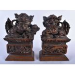 A PAIR OF LATE 19TH CENTURY CHINESE CARVED WOOD FIGURES OF BUDDHISTIC LIONS. 23 cm x 14 cm.