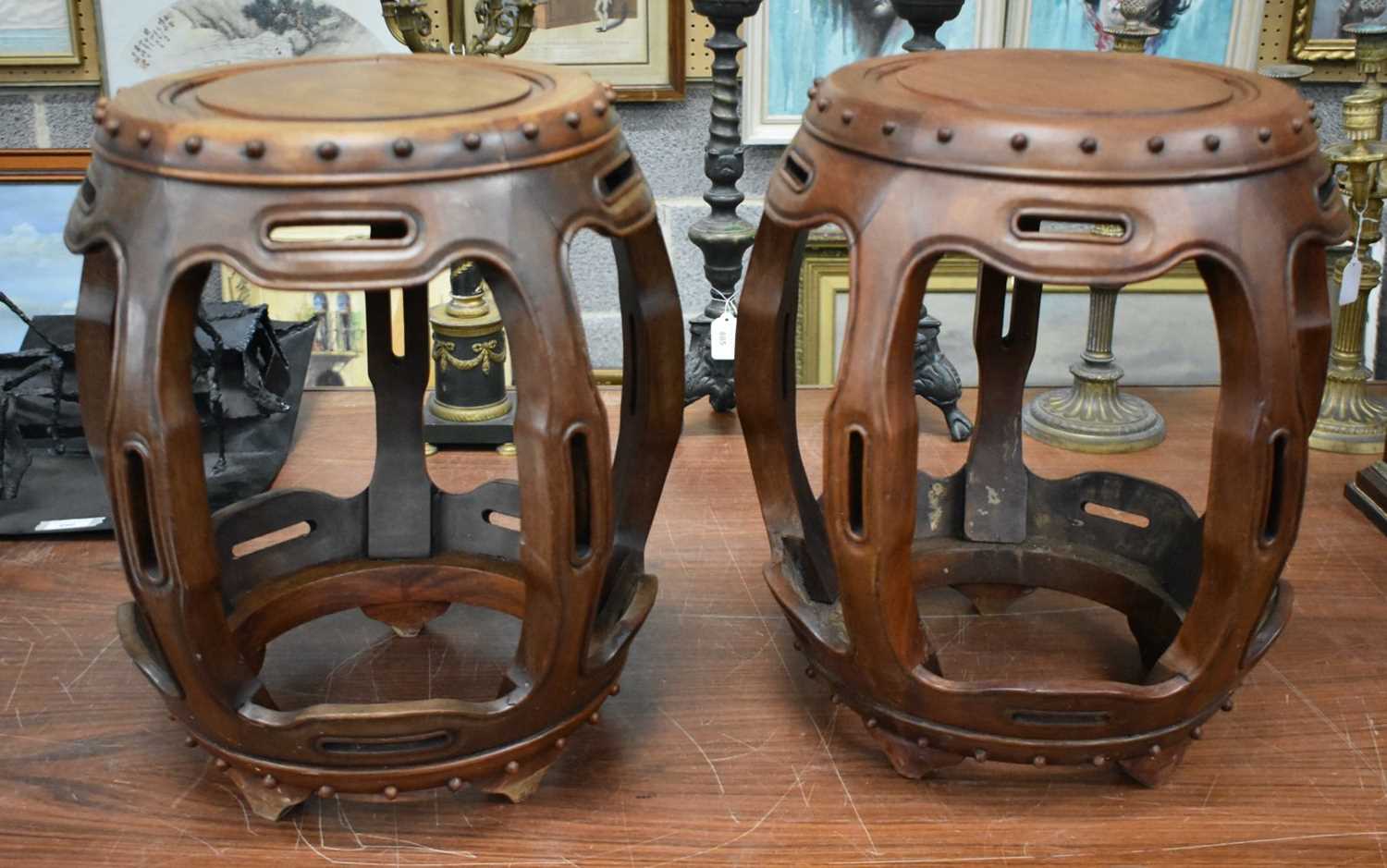 A PAIR OF EARLY 20TH CENTURY CHINESE HARDWOOD DRUM STOOLS. 45cm x 30cm.