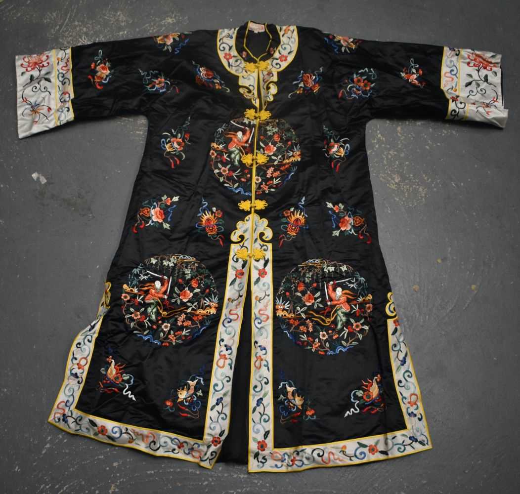 A CHINESE REPUBLICAN PERIOD SILK EMBROIDERED ROBE decorated with figures and foliage. 110 cm x 120