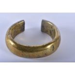 AN EARLY AFRICAN EASTERN ASIAN BRONZE TRIBAL BRONZE BANGLE. 10 cm wide.
