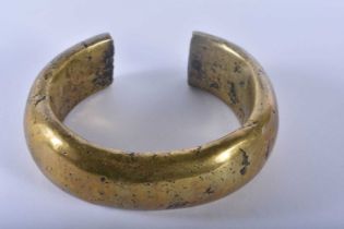 AN EARLY AFRICAN EASTERN ASIAN BRONZE TRIBAL BRONZE BANGLE. 10 cm wide.
