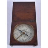 A Compass in a Wooden Case. 9cm x 9cm