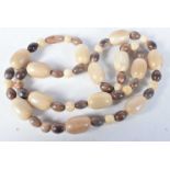 A 19TH CENTURY CHINESE CARVED BLOND RHINOCEROS HORN PRAYER BEAD NECKLACE Qing. 96 grams. 80 cm long,