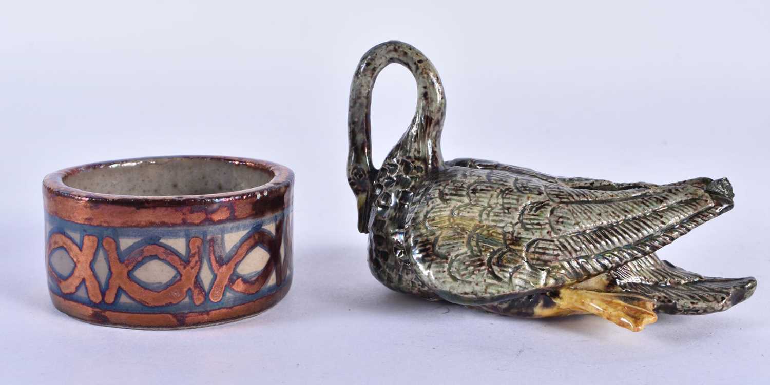 AN ANTIQUE CONTINENTAL MAJOLICA SWAN together with a small Hispano moresque type lustre salt.