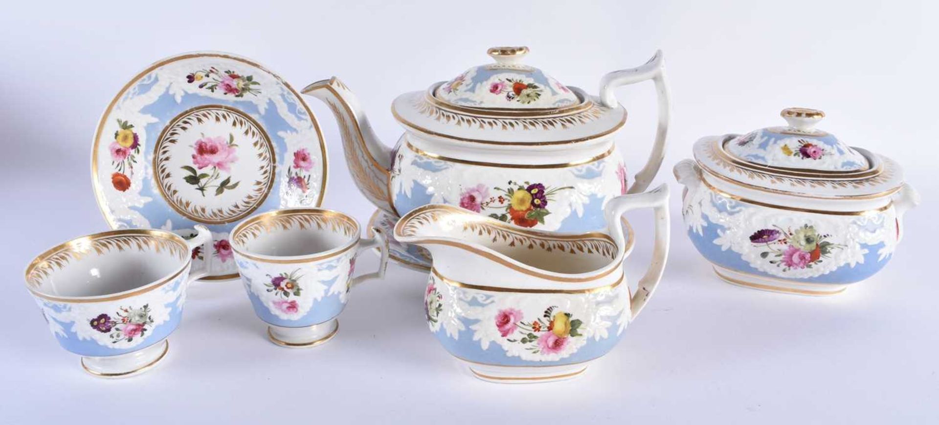 AN EARLY 19TH CENTURY CHAMBERLAINS WORCESTER PART TEASET painted with floral sprays, under a moulded