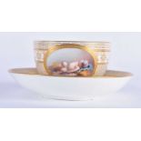 Minton teacup and saucer painted with a naked baby laying on a straw mattress, globe mark, made